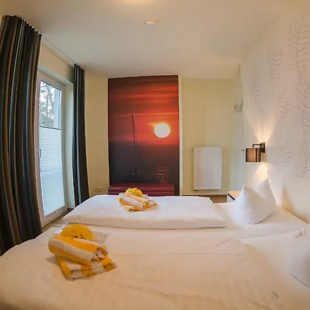 Апартаменты Apartmenthaus Kleiner Falke Остзебад Бинц